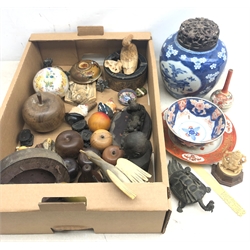  A large group of assorted items, to include an ivory figurine modelled as Ganesh, an ivory page turner with carved handle, a late 19th/early 20th century bronzed figure modelled as a Chinese dragon turtle, (a/f), an Imari tea bowl, a Japanese Kutani plate, a large witches ball with printed figural decoration, a selection of carved hardwood fruits, etc.     
