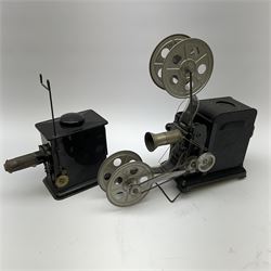 Early 20th century tinplate combined magic lantern and 35mm cinematograph projector, hand-cranked, with electric bayonet lamp, fitted with film reels, L35cm overall, and a similar projector by Gebruder Bing Nuremberg with spirit lamp (glass chimney a/f) L22cm, with two reels of film 