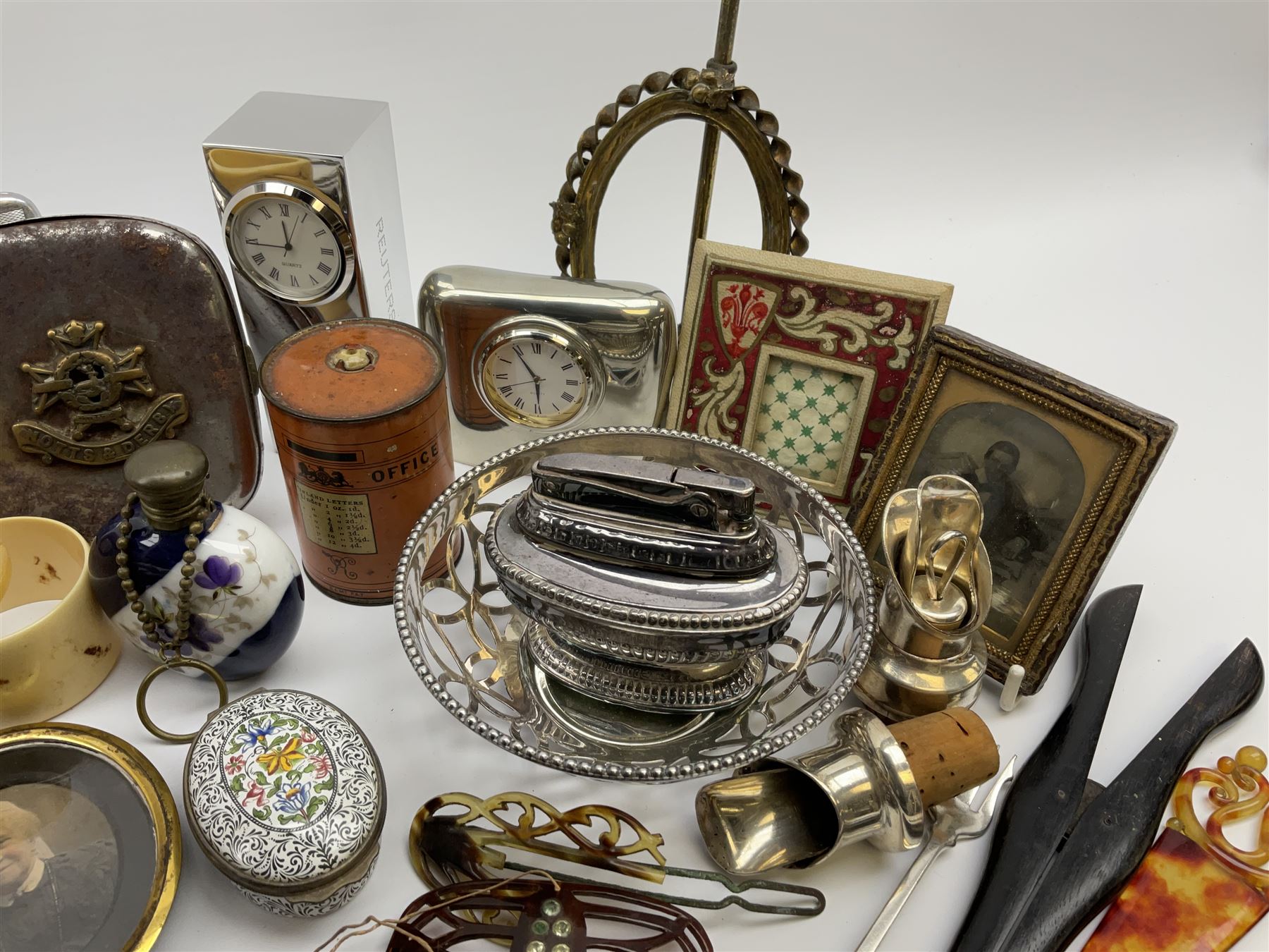 A group of assorted collectables, to include small oval purple guilloche enamel frame, WWII matchbox holder depicting Winston Churchill, Halcyon Days enamel box, Ronson table lighter, ebonised glove stretchers, ivory napkin ring, mother of pearl handled button hook, engine turned cigarette case, etc. 