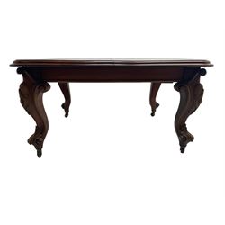 Victorian mahogany extending dining table, moulded rectangular top with rounded corners, telescopic mechanism with leaf and winding handle, on leaf and cartouche carved cabriole supports, brass and ceramic castors