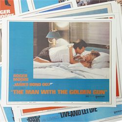  Collection of seventeen James Bond lobby cards starring Sean Connery and Roger Moore including Thunderball, You only Live Twice, Live and Let Die, From Russia with Love etc each 21cm x 27.5cm 
