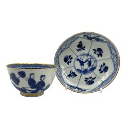 18th century Chinese tea bowl and saucer, blue and white figures in a landscape pattern, with paneled floral decoration to the saucer with gilt rims, teabowl H5cm, saucer D11cm