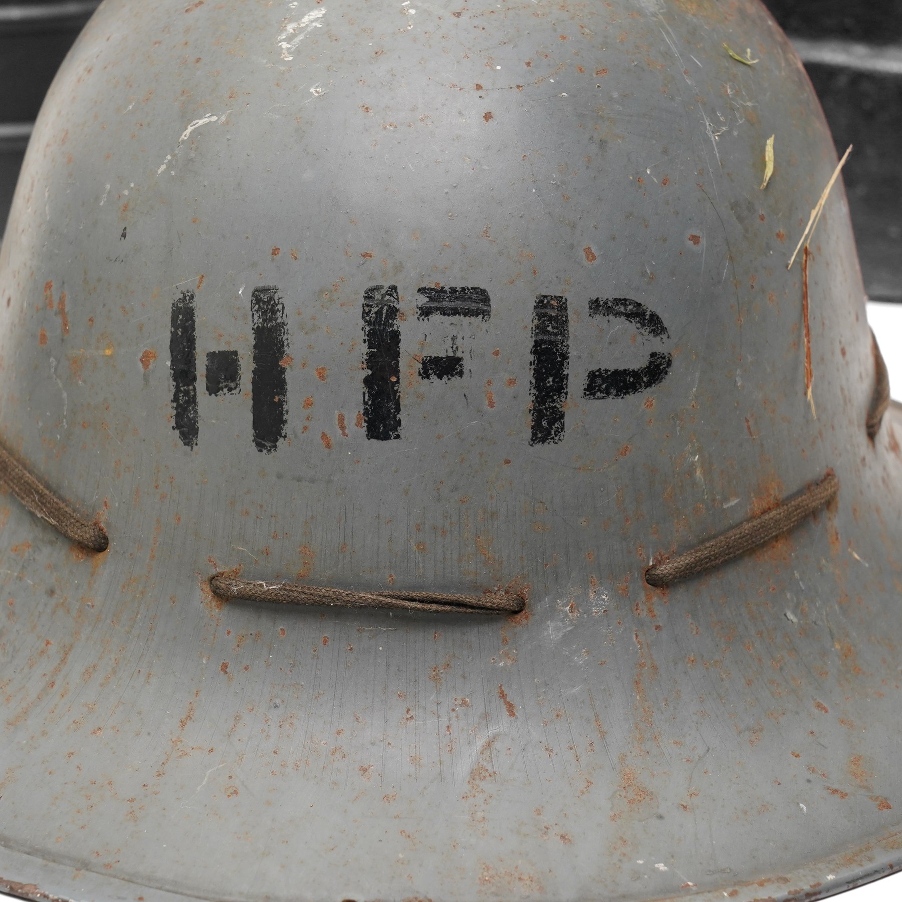 British military leather cordite shot carrier with coat of arms H52cm, Zuckerman Civil Defence helmet with liner and inscribed H.F.P. (Head of Fire Party),  and two gas masks