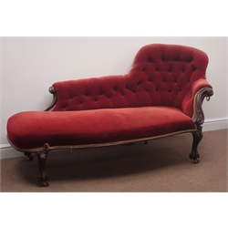  Victorian walnut framed chaise lounge, upholstered in red fabric with deeply buttoned back, scrolled arm with carved cabriole supports, L185cm  