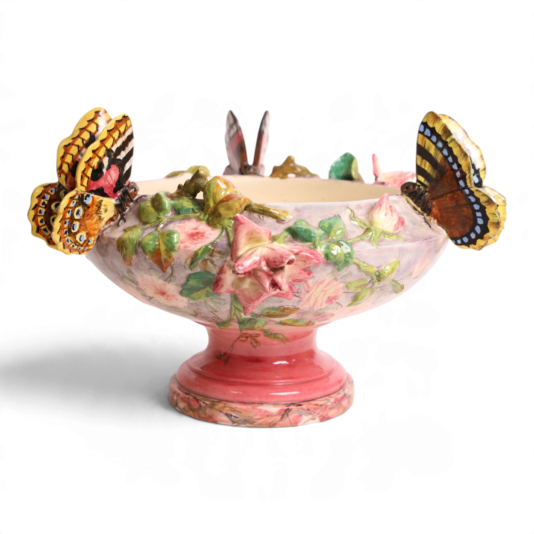 Delphin Messier (1836-1907), glazed earthenware cache-pot, decorated with three butterflies surrounded by floral and foliate motifs. upon a pink circular foot, signed beneath, H24cm