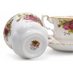  Royal Albert Old Country Roses tea and dinner service comprising nine dinner plates, nine dessert plates, nine cups, eight saucers, milk jug, salt and pepper, bread knife and two saucer dishes