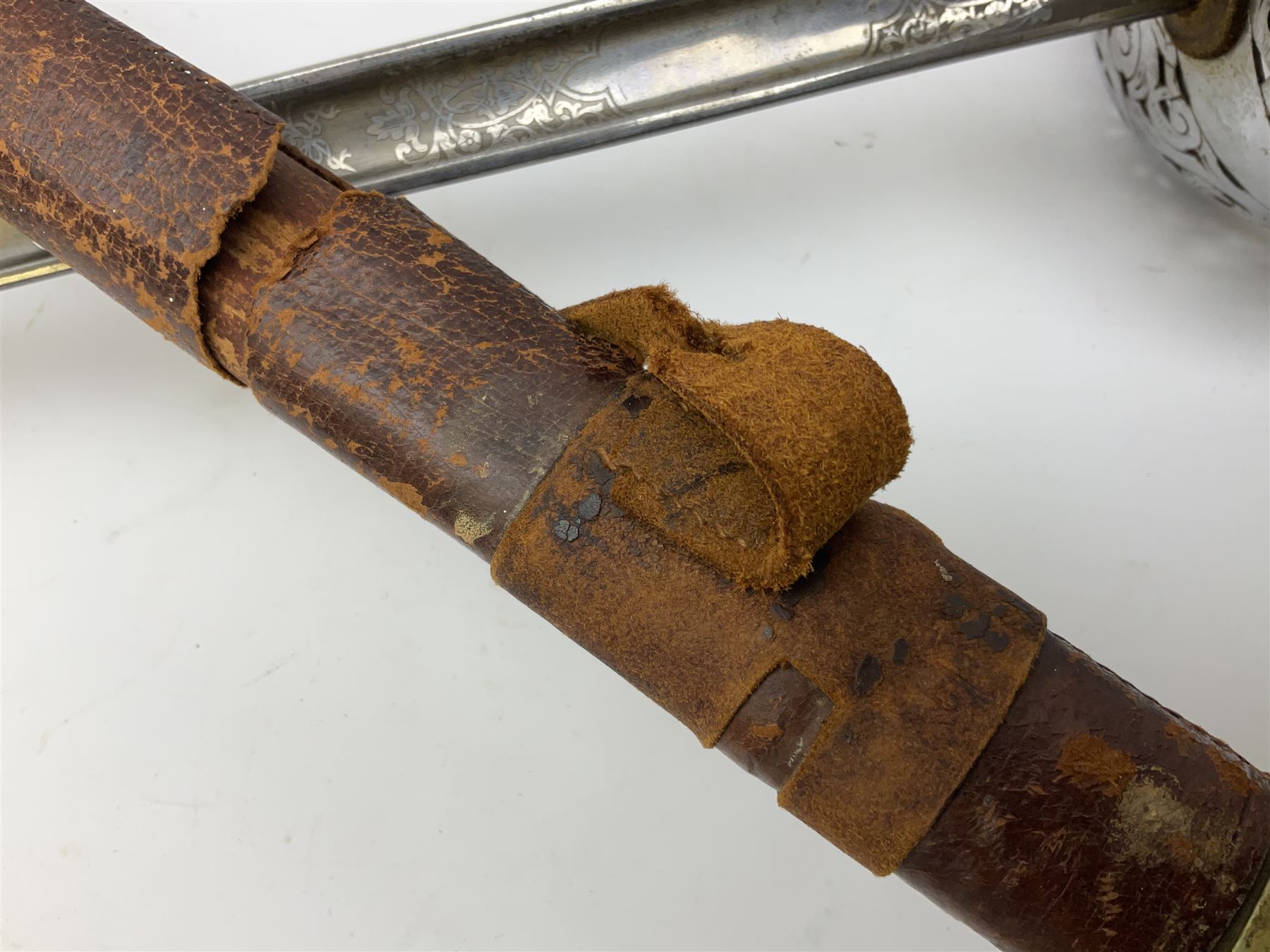 British George V 1897 Pattern Infantry Officers Sword, the 82.5cm fullered steel blade etched and polished with crowned royal arms, GRV cyphers and scrolling foliage, marked Army & Navy Co-operative Society 105 Victoria St London SW to the ricasso,  plated pierced basket hilt with wire bound fish skin grip and leather knot, No.15032; in leather covered scabbard