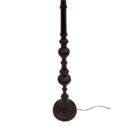 20th century walnut standard lamp, turned column on circular base, with shade 