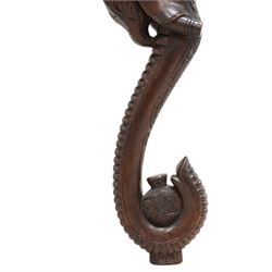 Anglo-Indian hardwood occasional table, circular top carved with concentric pattern and scrolling foliage, on three elephant carved supports decorated with flower heads