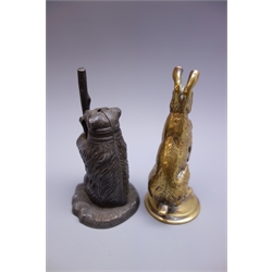  Brass car mascot in the form of a Kangaroo, stamped AEL to circular base, traces of plating H11cm and die-cast caster in the form of a muzzled bear holding a staff H11cm (2)  