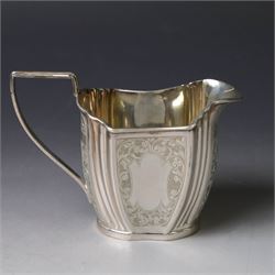 Late Victorian silver twin handled open sucrier and milk jug, of fluted form with panels of engraved foliate decoration, hallmarked D & M Davis, London 1896