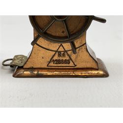 Copper tape measure in the form of a ship`s wheel, marked 'Rd. 128885' to the front, and a celluloid tape measure in the form of a galleon, wheel H4cm