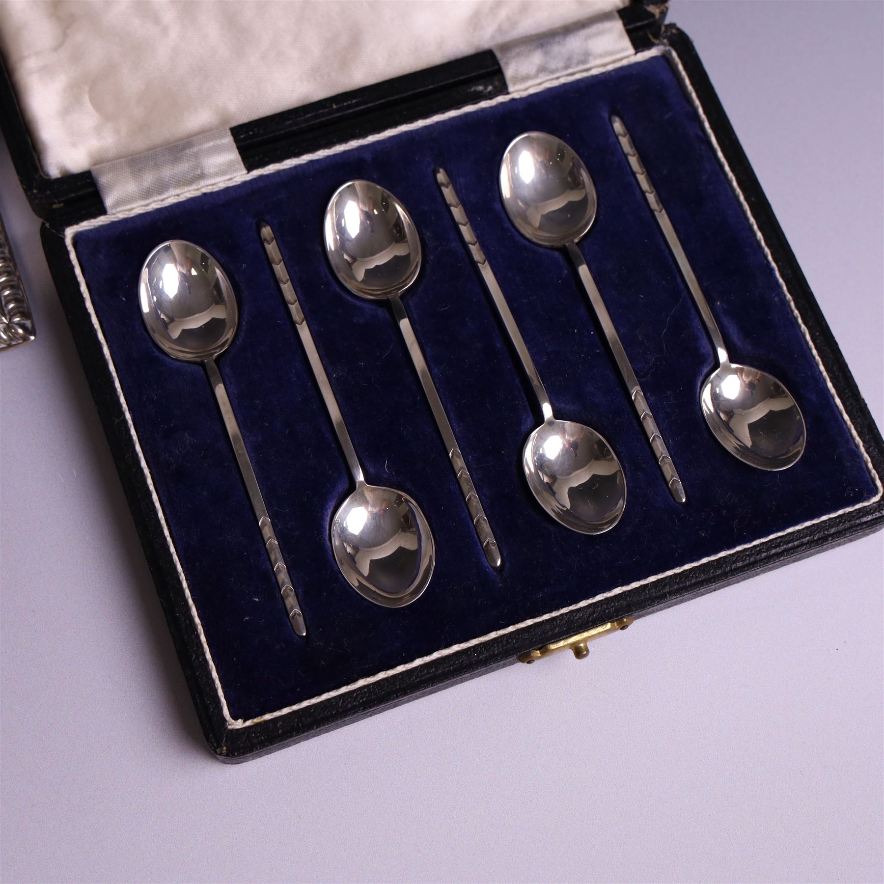 Late Victorian silver mounted stamp box, the hinged lid with three glazed panels, hallmarked Grey & Co, London 1900, together with a late Victorian silver hair comb and a cased set of six silver coffee spoons