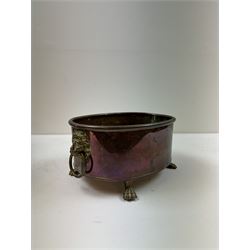 Copper and brass planter, of oval form, with twin lion's head and ring handles, together with two similar rectangular planters  