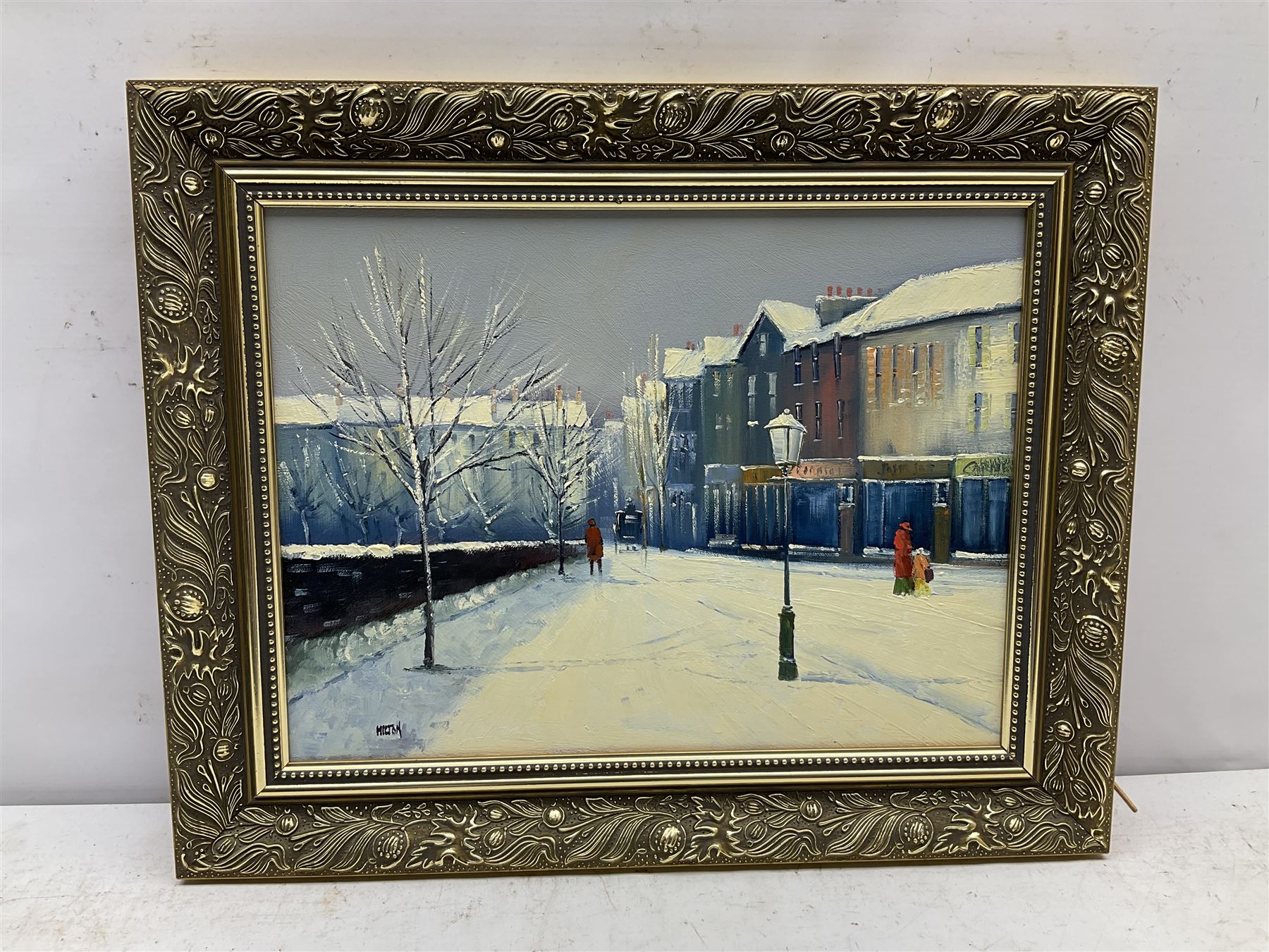 Barry Hilton (British 1941-): Snowy Winter Street Scene, oil on canvas signed 29cm x 39cm