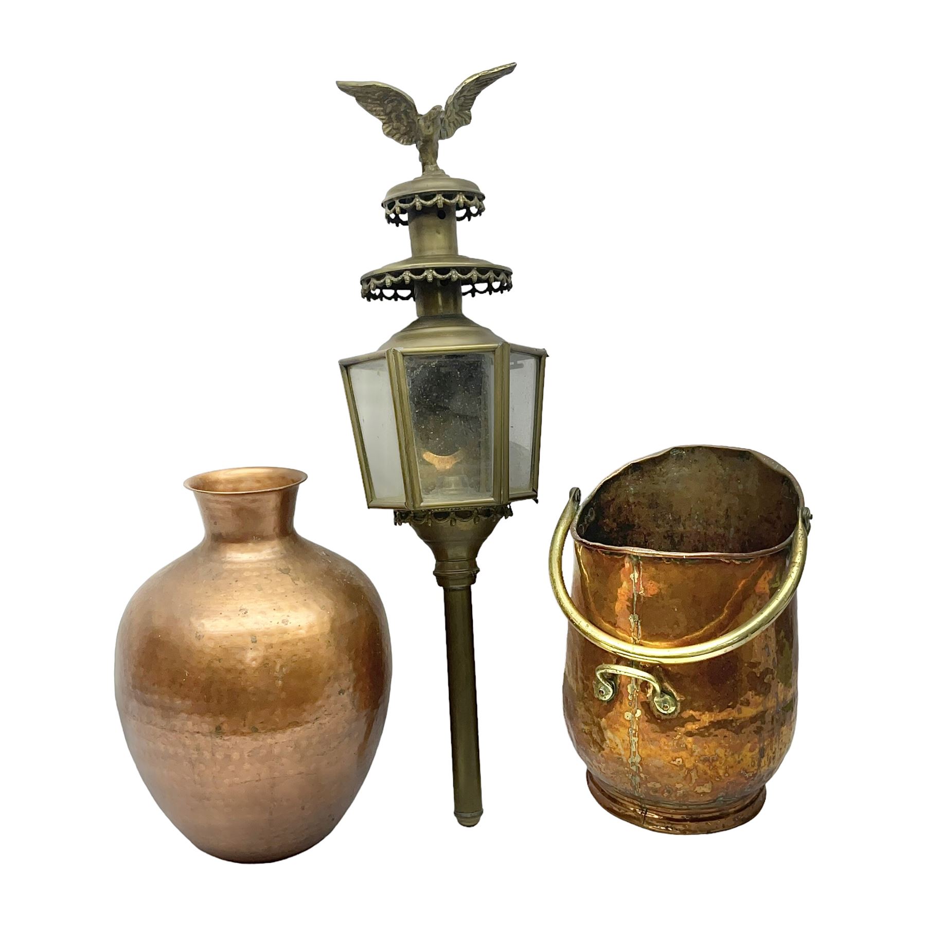 20th century brass carriage lantern, with six glass panels and eagle finial, together with a copper coal scuttle and hammered copper vase, lantern H77cm