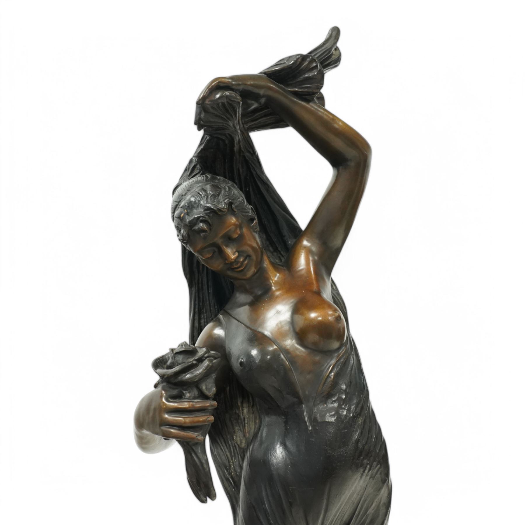 Giorgio Ceragioli (Italian 1861-1947): 'Danza Del Flori' -The Flower Dancer, large patinated bronze figure of a female dancer draped in a flowing garment and holding a rose, on a circular naturalistic floral base, on a marble plinth, signed and dated 1910, titled to the front, H140cm