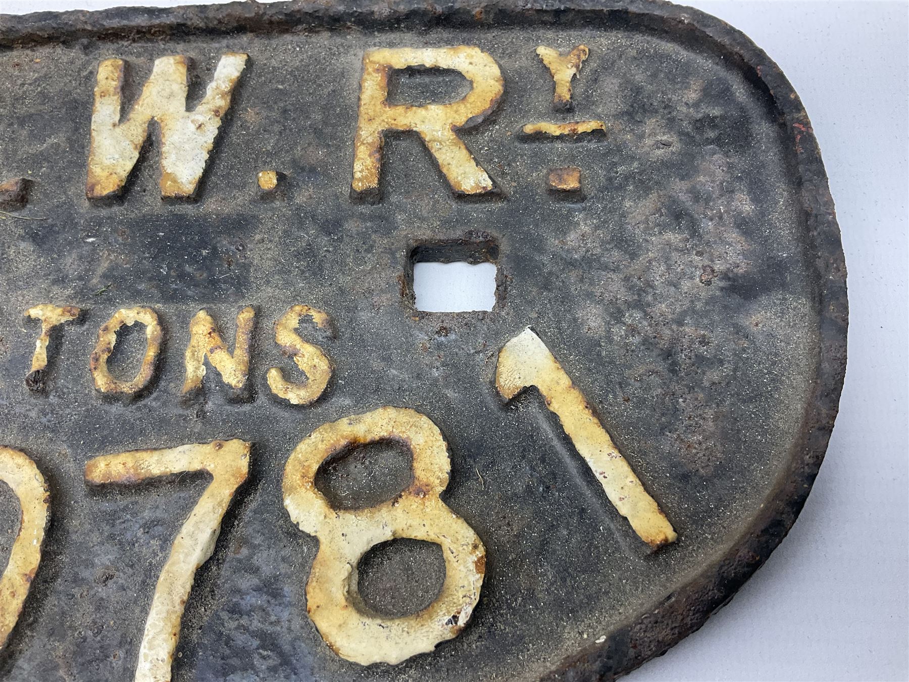 Three cast iron railway wagon plates of D shaped form to include Southern Railway, LMS and GWR, L27.5cm