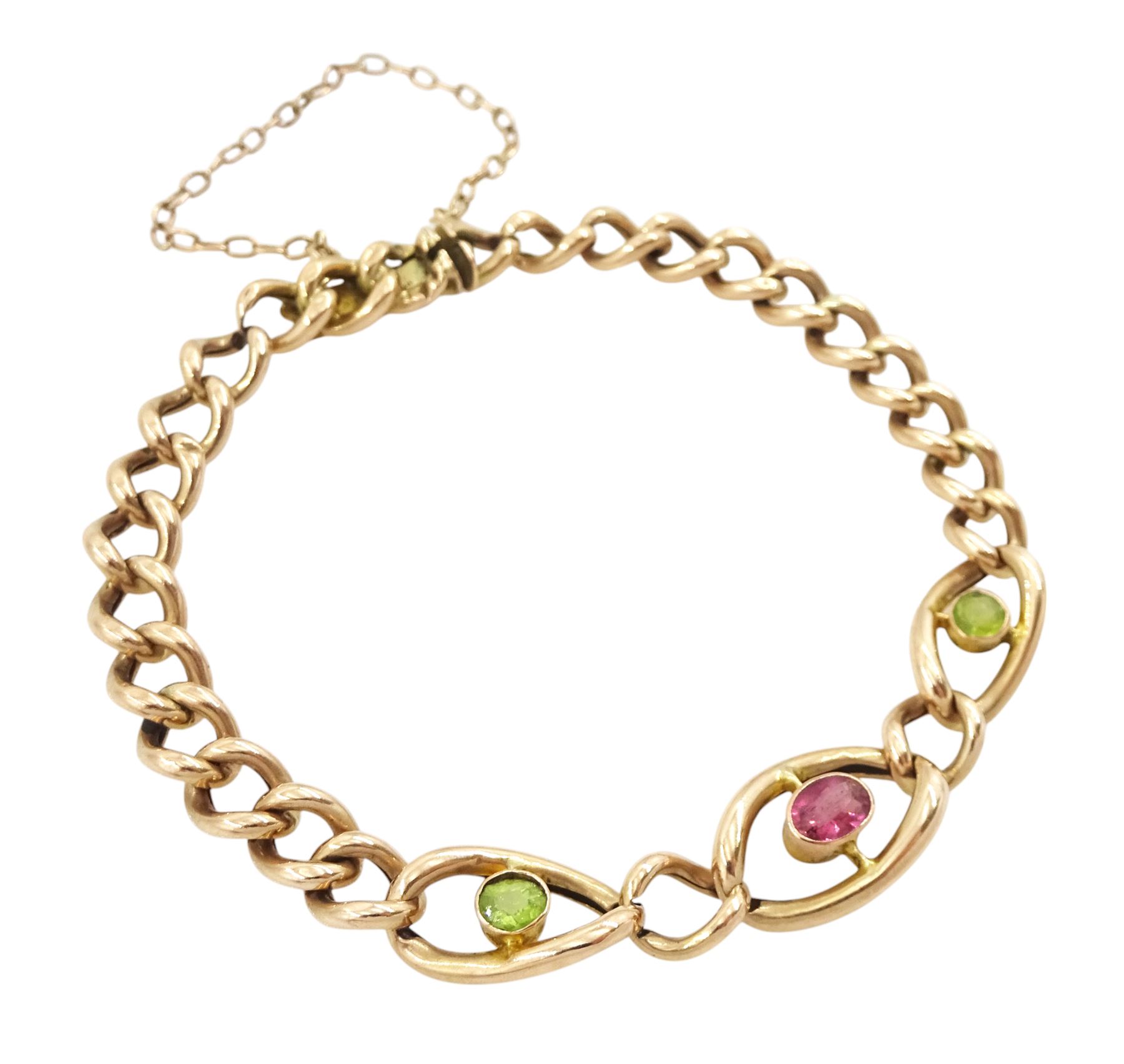 Early 20th century rose gold three stone pink tourmaline and peridot curb link bracelet, stamped 9ct