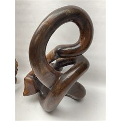 Helen Skelton (British 1933 – 2023): Two carved wooden abstract sculptures, one modelled as a entwined knot, largest H48cm. Born into an RAF family in 1933 in Kent and travelled the world extensively during her childhood. After settling in Bridlington, Helen immersed herself in painting, textiles, and wood sculpture, often inspired by nature's beauty. Her talent was showcased in a one-woman show at Sewerby Hall and recognised with the sculpture prize at Ferens Art Gallery in 2000. Sadly, Helen’s daughter passed away from cancer in 2005. This loss inspired Helen to donate her sculptures to Marie Curie upon her passing in 2023.