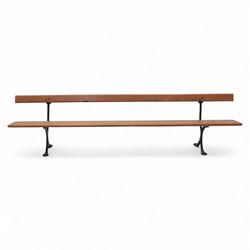 Pine garden bench, with stained and weatherproof varnish, single slat pine seat and back, raised on curved black cast iron supports