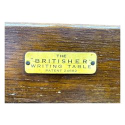 Edwardian oak metamorphic 'Britisher Writing Table', rectangular hinged top revealing correspondence compartments and hinged writing surface with underside storage, flanked by twin hinged compartments with dividers, on turned supports