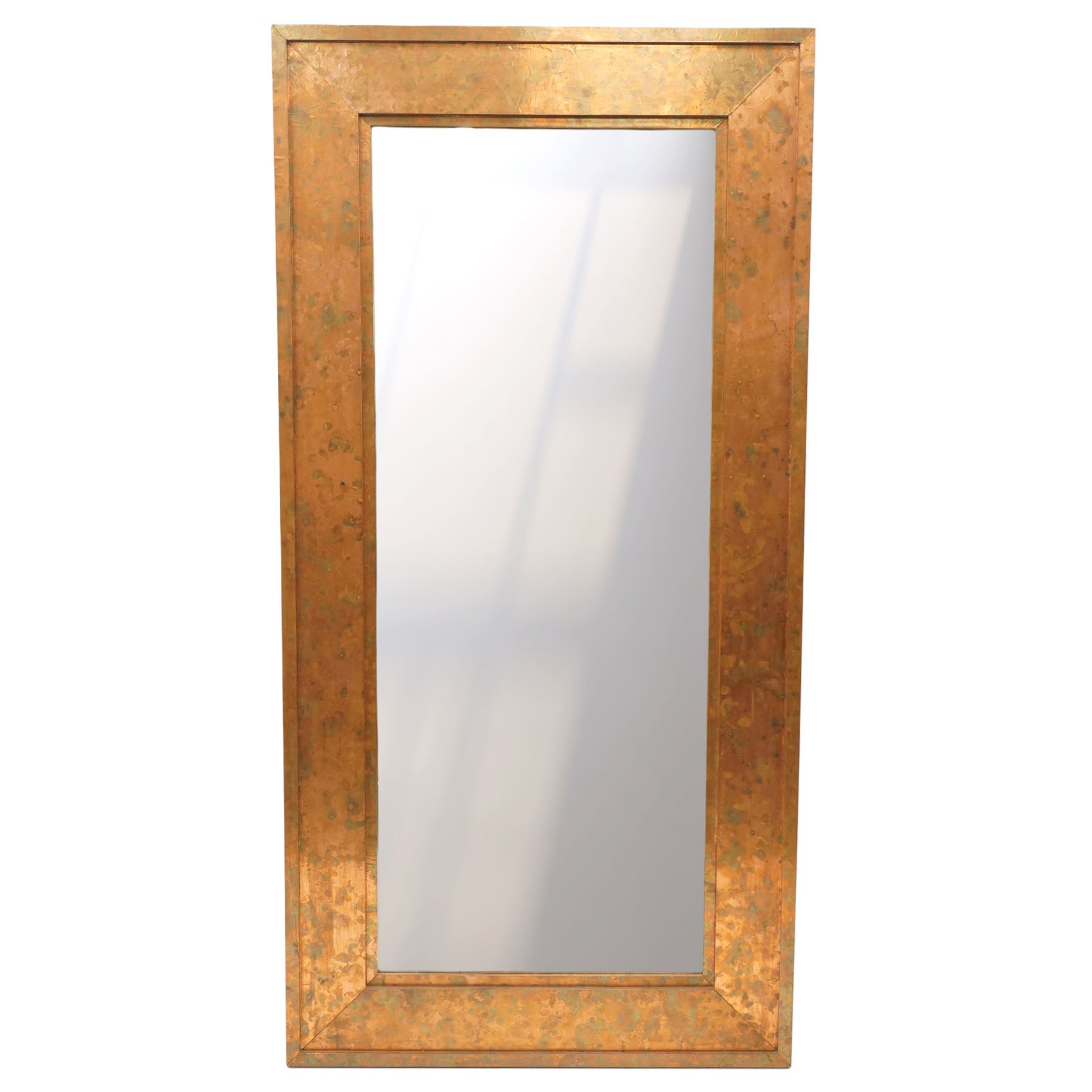 Large contemporary distressed copper effect framed wall mirror, stepped frame enclosing a bevelled mirror plate