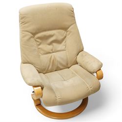 Himolla - A pair of swivel reclining chairs, beige upholstered with padded arms and high back rest, raised on a laminated circular wooden base with swivel mechanism 