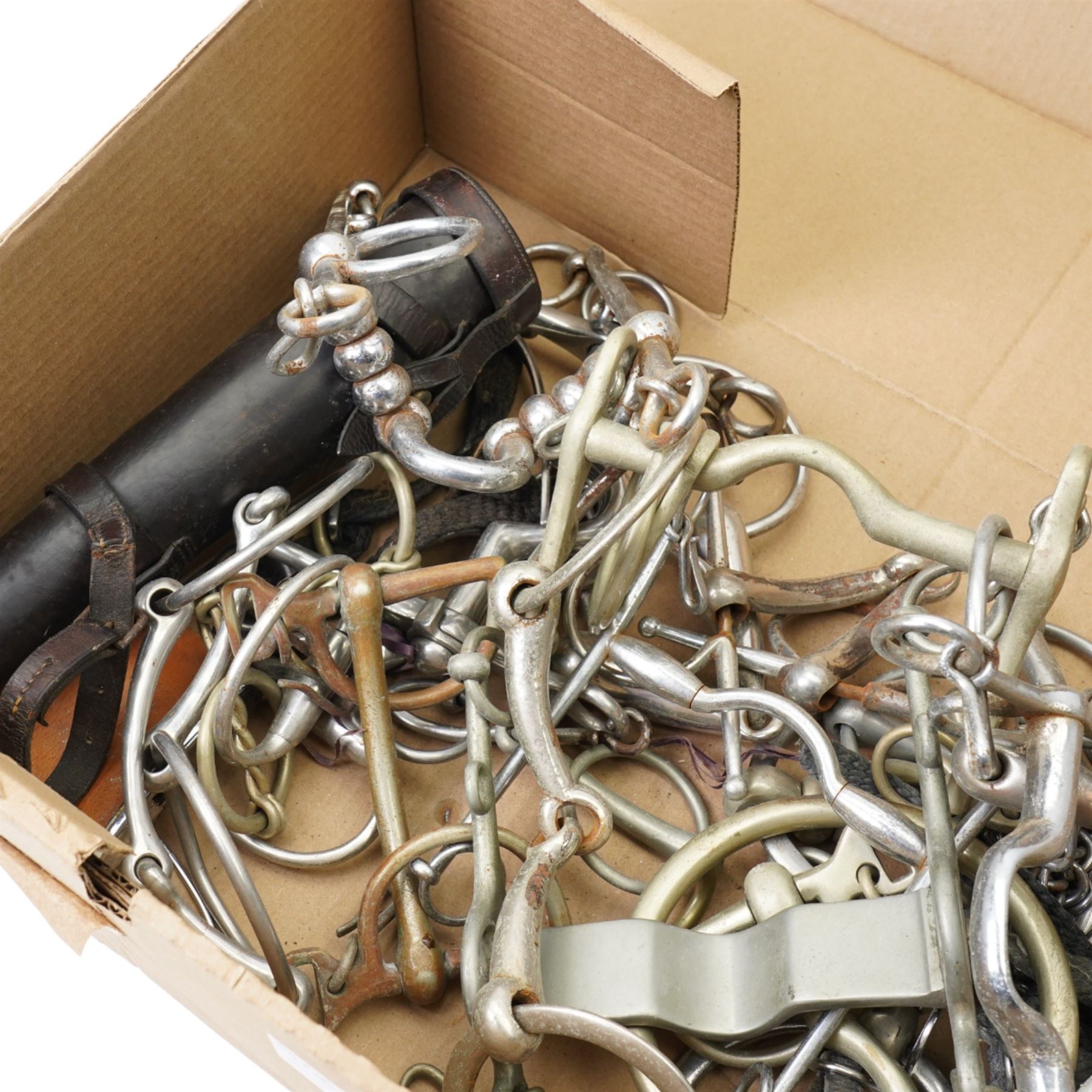 Large collection of bits, grackles and snaffles, together with spurs and leather case for hunting flask etc
Provenance: from the Kirkham Hall estate. 