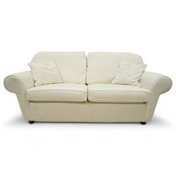 Large traditional shape two-seat sofa (W213xm, H101cm, D94cm); together with matching armchair (W116cm); and footstool (53cm x 78); upholstered in cream textured fabric