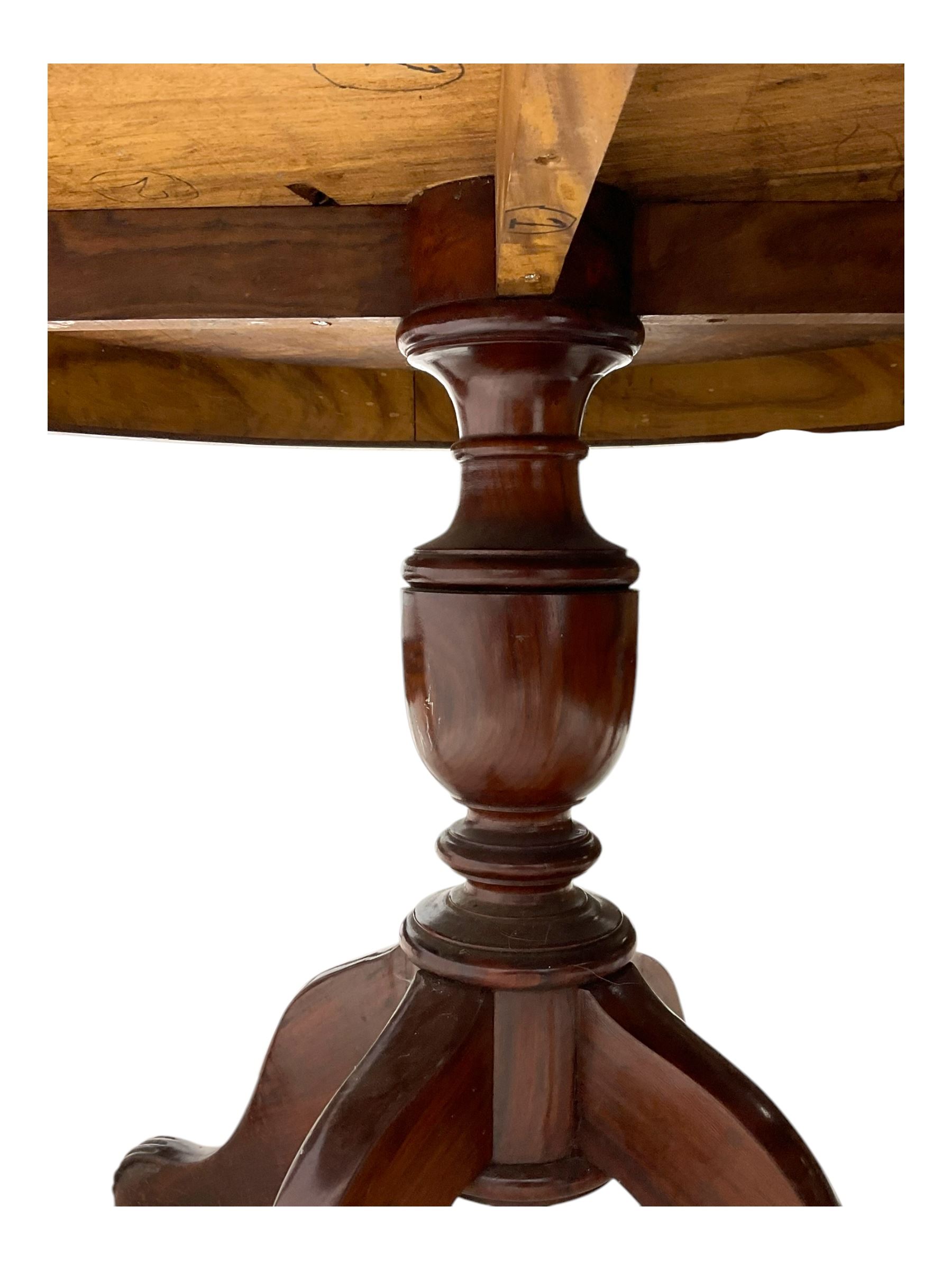 Pakistan carved hardwood brass inlaid circular dining table, and four rail back chairs with saddle seats