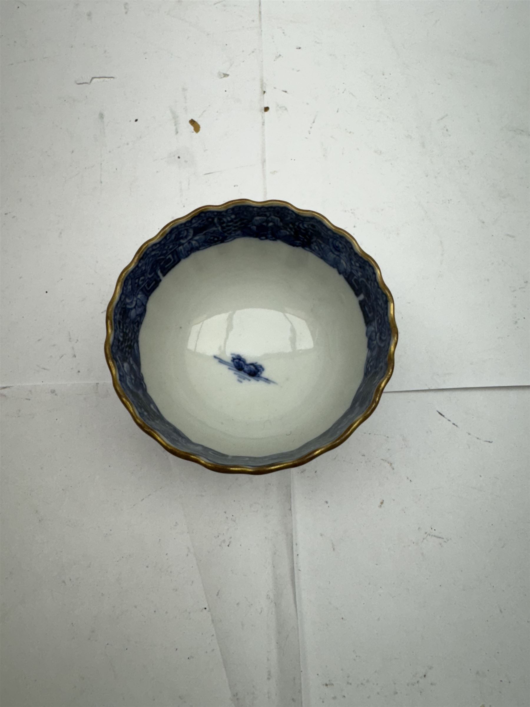 Pair of Staffordshire figures modelled as chained Dalmatians seated upon cobalt blue oval bases, H13cm, together with a Staffordshire pastille burner modelled as a castle, H12cm, a pair of 19th century Derby potpourri pots (lacking covers), and an 18th century blue and white tea bowl 