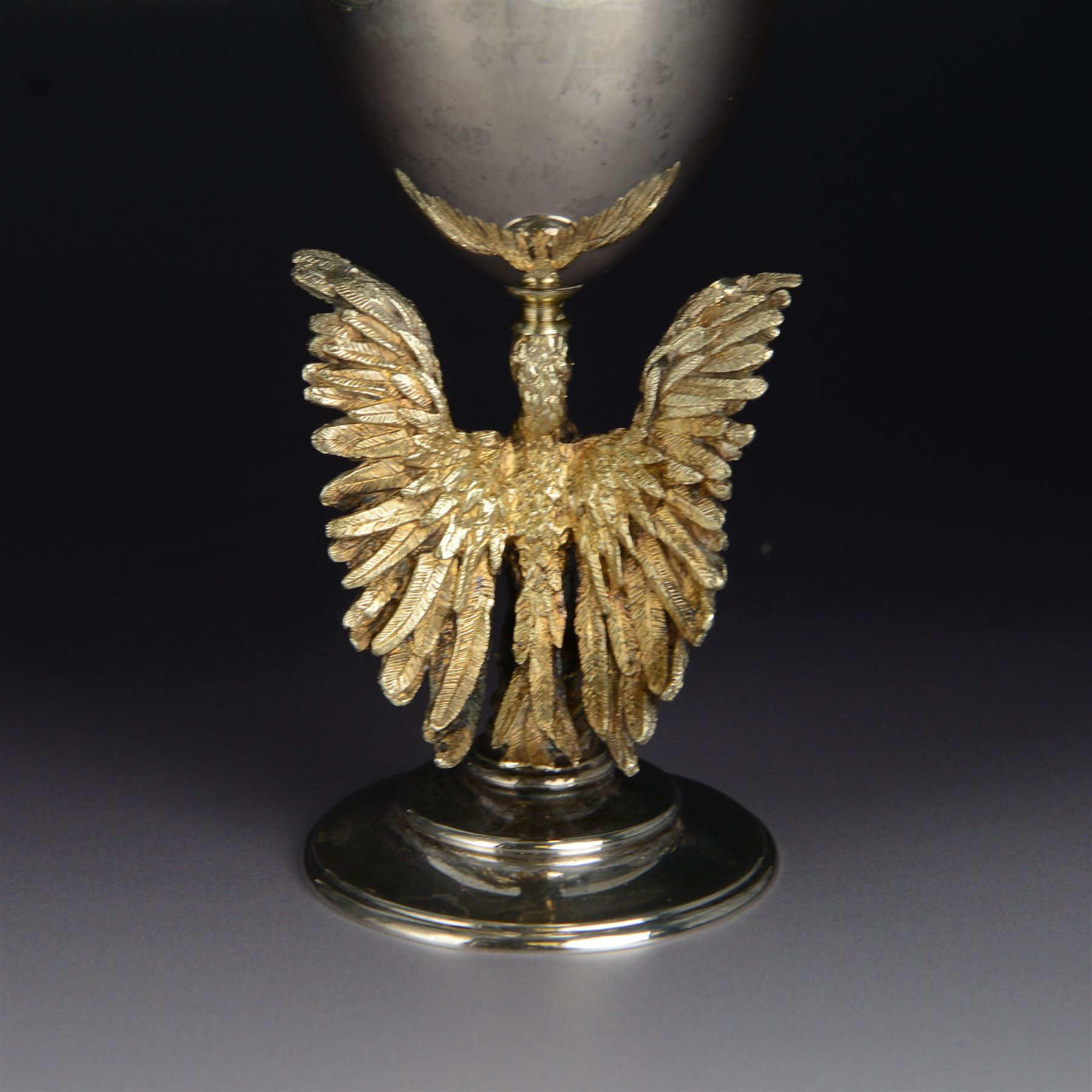 Modern limited edition silver goblet, 'made by order of the Dean and Chapter of St Paul's to commemorate the 300th anniversary of the laying of the foundation stone of the cathedral in 1675', designed by Jocelyn Burton for Aurum, the plain bowl with gilt interior, upon a parcel gilt stem in the form of a phoenix with wings outstretched,  limited edition no. 497, hallmarked Jocelyn Burton, London 1975, H16cm, boxed