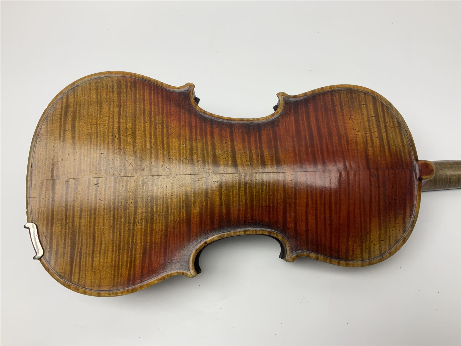 Late 19th century French three-quarter size 'Conservatory' violin with 34cm two-piece maple back and ribs and spruce top, the peg box inscribed 'Conservatory Violin Straduari', bears label 'Antonius Stradiuarius Cremonensis Faciebat Anno 1721' L55.5cm overall; in ebonised wooden 'coffin' case; and Saxony violin c1900 with 36cm two-piece maple back and ribs and spruce top; bears label 'Antonius Stradivarius Cremonensis Faciebat Anno 17**' L59cm overall; in carrying case (2)