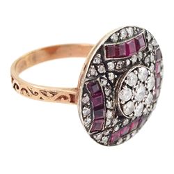 Rose gold and silver ruby and diamond circular ring, the central cluster set with eight round brilliant cut diamonds, with calibre cut ruby and single cut diamond surround, total diamond weight approx 0.90 carat, total ruby weight approx 0.75 carat