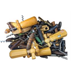 Collection of approximately fifty seven corkscrews, including turned wooden and metal examples