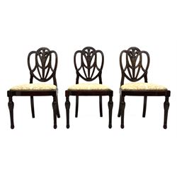 Set eight early 20th century mahogany Hepplewhite style dining chairs, the shaped fleur-de-lis feather carved back with linen swags and moulded frame, sprung drop in seats upholstered in gold floral pattern fabric, on turned acanthus carved and reeded supports, the carvers with shaped moulded arm supports and flower head carved terminals