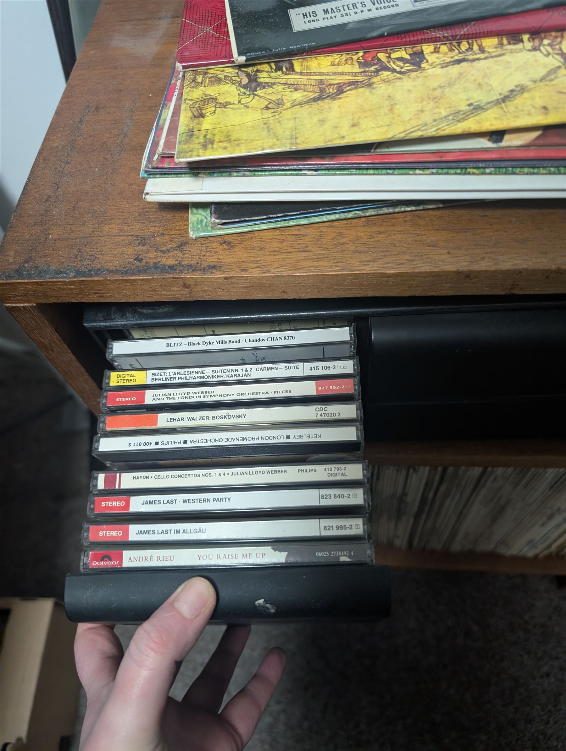 Large collection of vinyl LPs, together with a small collection of 7 inch vinyl records and CDs, with a Dansette record player and a small Hi-Fi cabinet