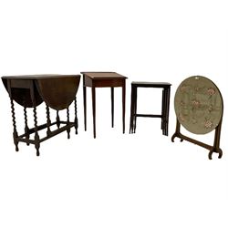 Early 20th century drop leaf table, sloped top clerks desk, nest of three tables and a needle work panel metamorphic firescreen/table