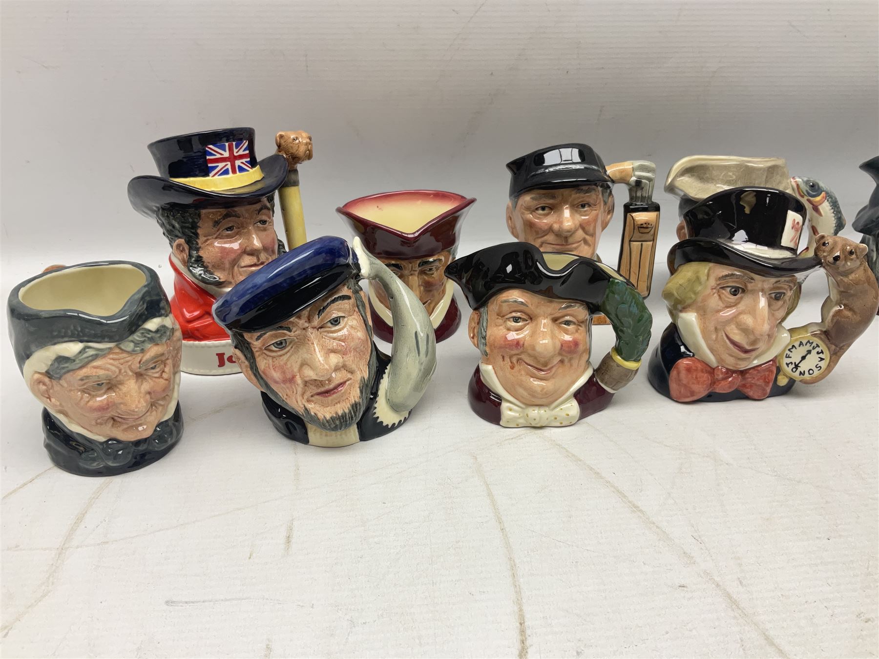 Large collection of Royal Doulton miniature character jugs, to include The Postman D6801, The London 'Bobby' D6762, Old Salt, D6554, Sir Henry Doulton D6703 etc  