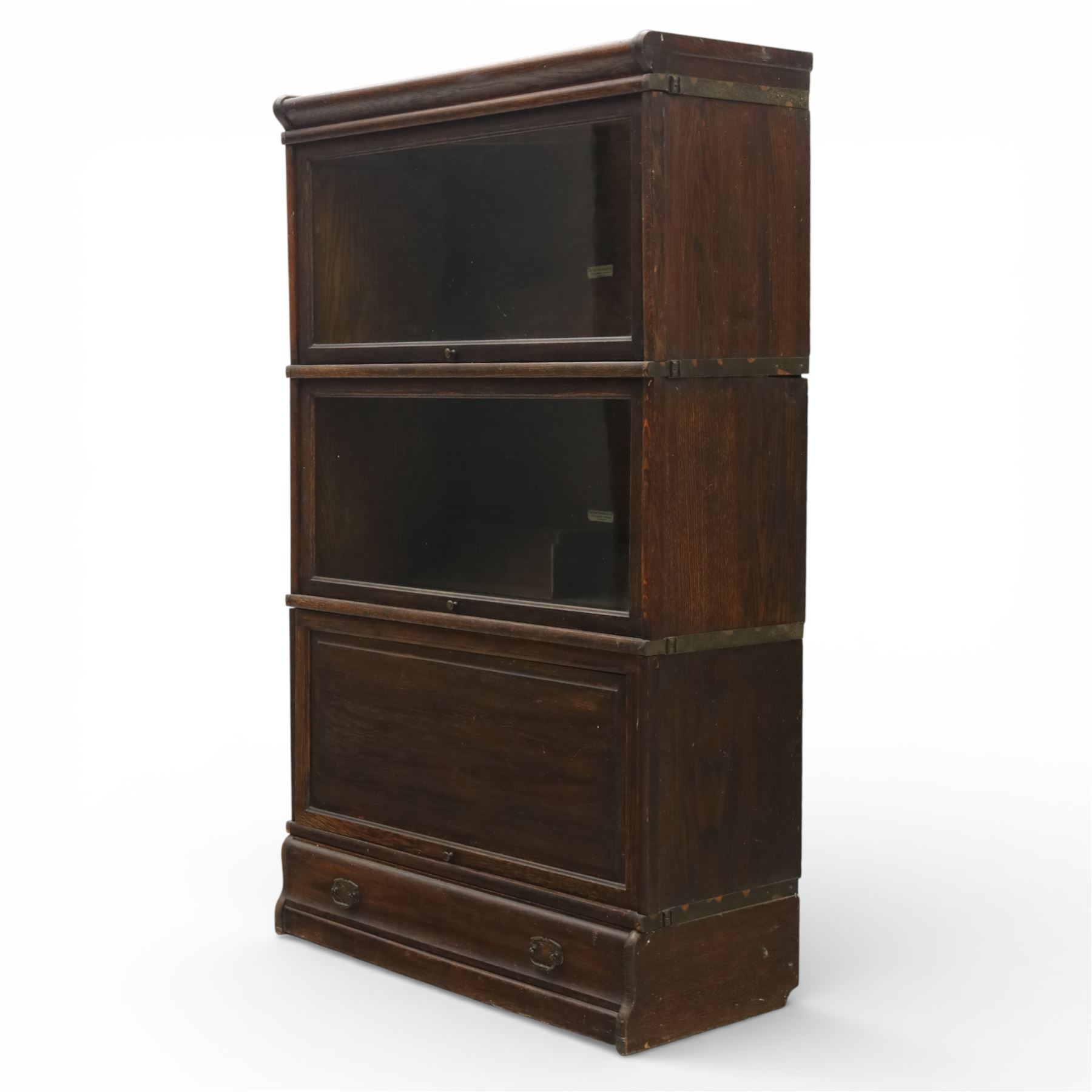 Globe Wernicke - early 20th century three sectional stacking library bookcase, two glazed sections above a panelled section, on a plinth base with inbuilt drawer
