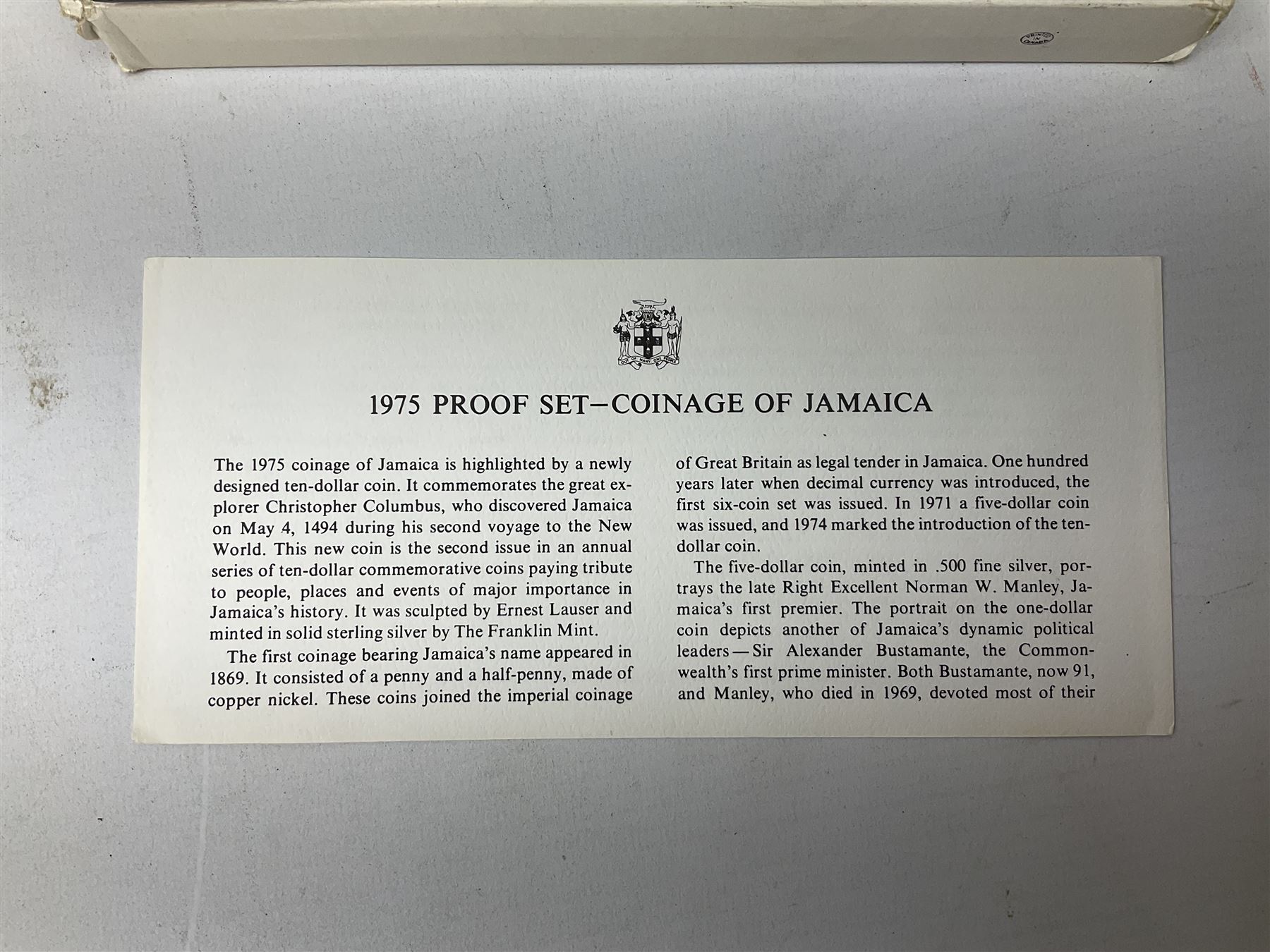 Jamaica 1975 eight coin proof set produced by the Franklin Mint and a Jamaica 1978 sterling silver proof twenty-five dollar coin, both cased with certificates
