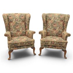 Parker Knoll - pair of mid-20th century wing back armchairs, upholstered in tapestry fabri...