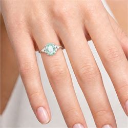 18ct white gold Paraiba tourmaline and diamond ring, single oval cut tourmaline of approx 0.95 carat, with three round brilliant cut diamonds set either side, Birmingham 2008