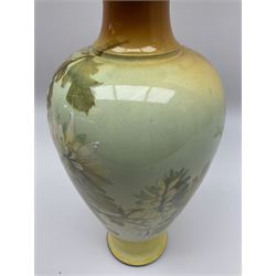 A Doulton Lambeth vase, of baluster form with flared rim decorated with white flowers upon a yellow ground, with printed, impressed and painted marks beneath, H35cm.