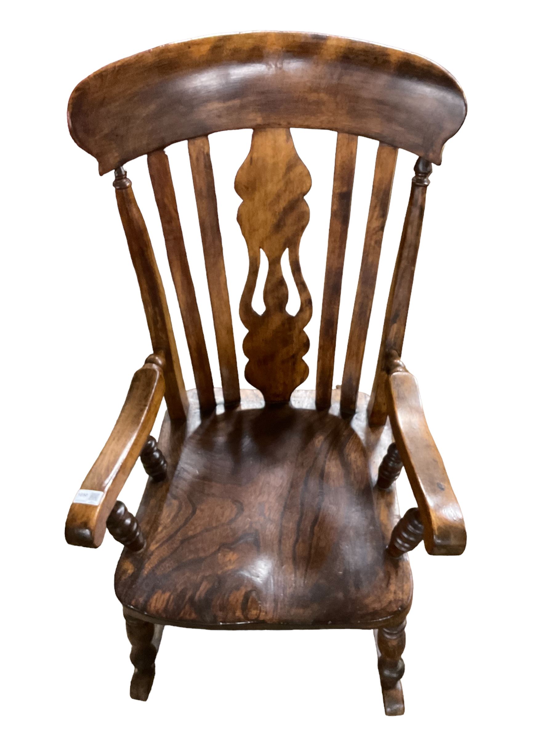 Late 19th century elm and beech farmhouse rocking chair, pierced splat and lath high back over saddle seat with turned supports