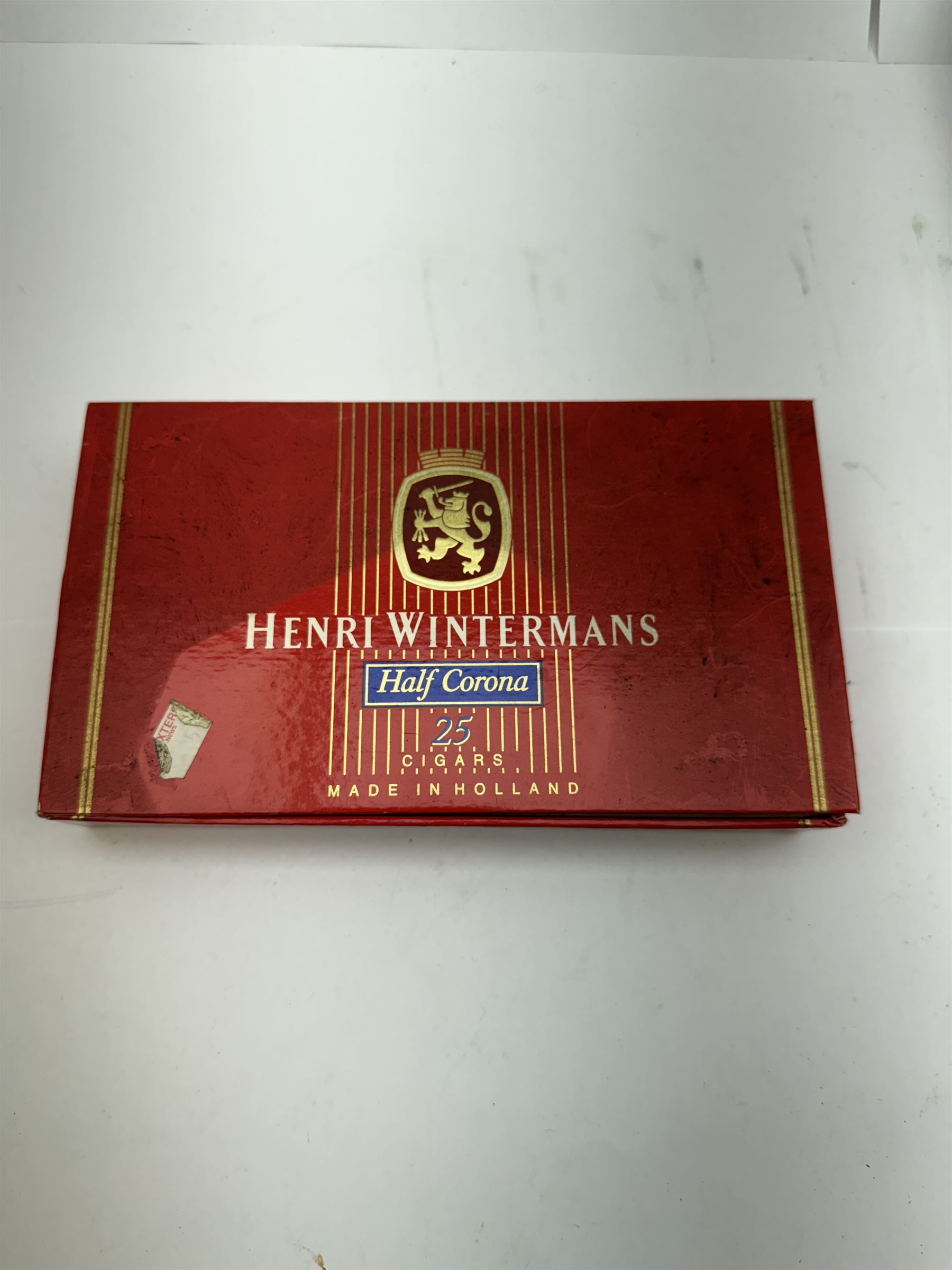 Box of Henri Wintermans Half Corona cigars, together with a collection of lighters, including Ronson, Calibri and Mosda examples, contained within an empty Dannemann Brasil cigar box and other smoking related collectables