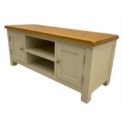 Oak and white painted television stand, fitted with two cupboards and centre shelves