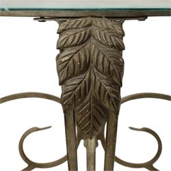 Wrought metal and glass table, with silvered foliate and scrolled design