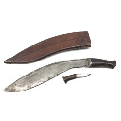  Kukri knife, 35cm curved steel blade stamped on back F.W, with shaped hardwood grip, and one skinning knife, L45cm, in stitched leather sheath with metal tip,    